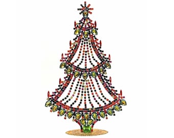 May include: A decorative Christmas tree ornament constructed from a metal frame adorned with numerous multi-coloured rhinestones in shades of red, green, orange, and black. The structure features a star topper and a circular gold-toned base.