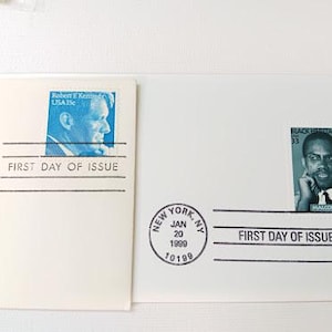 Jfk & malcolm x first day issue stamps / envelopes.  33c; 15c.