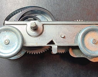 Original vintage toy motor replacement mechanical car windup. 2-3/4" x 1"