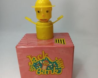 Cofrinho de brinquedo de baquelite da década de 1950. Veja fotos e descrição. Completo