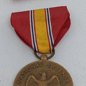 National defense service medal. featuring the bald eagle.  korean/vietnam/gulf war etc.