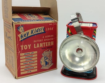 Vintage ohio art toy lantern in the original box. #12 with morse code and ship flags.