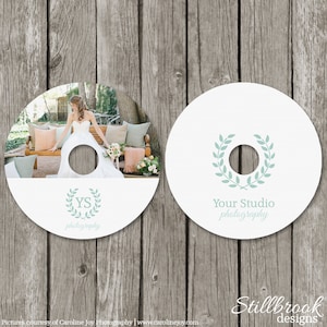 May include: Two white CD-ROMs with a wedding theme. One CD features a bride in a white dress. The other CD has a wreath design and the text "Your Studio photography". The text "YS photography" is also visible.
