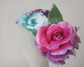 Printed floral and fabric flower fascinator with velvet and gold leaves