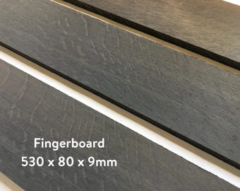 May include: Three dark gray wooden fingerboards, each measuring 530 x 80 x 9 mm. The fingerboards have a natural wood grain pattern.