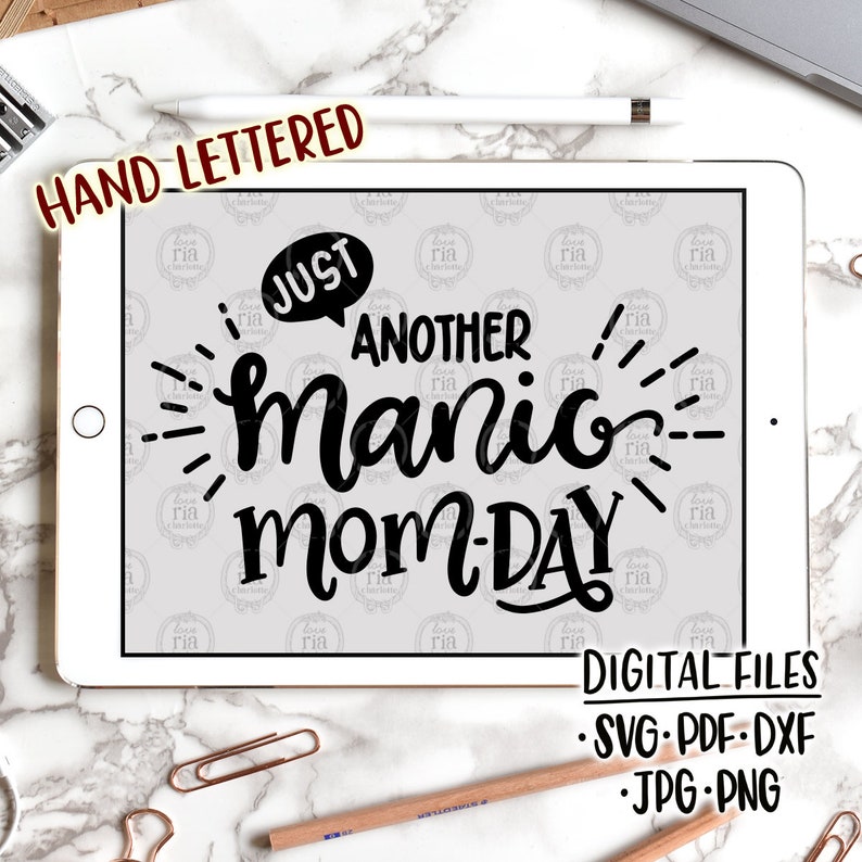 May include: A digital design file for a printable graphic that says "Just another manic mom-day". The graphic is in black and white and has a hand-lettered style.
