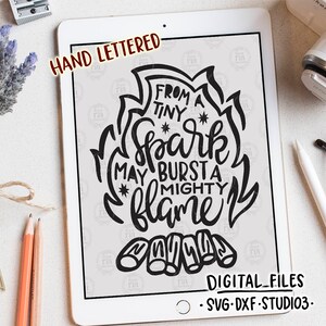 May include: Black and white hand-lettered design with the text "From a tiny spark may burst a mighty flame". The design features a stylised flame with a cluster of logs at the base.