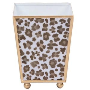 May include: A white ceramic mug with a black handle and the text "But First, Coffee" in a handwritten style. The mug is on a white surface. The mug is approximately 4 inches tall.