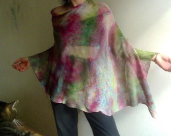 May include: A colorful, abstract patterned poncho with a loose, flowing fit. The poncho is made of a soft, lightweight fabric and features a variety of colors, including pink, green, and blue.