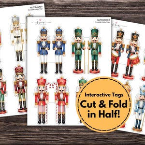 May include: Sheets of printable Christmas nutcracker tags in various colors, including red, blue, and green. The tags feature detailed illustrations of nutcracker soldiers. The text "Interactive Tags Cut & Fold in Half!" is visible.