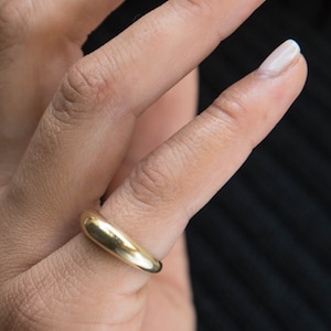 Inspired by great grandmother's wedding band with soft curves. A signature, classic piece you'll wear for every occasion of your life.  Made in solid 14K Gold this dome ring is coming in 3 different options/wide