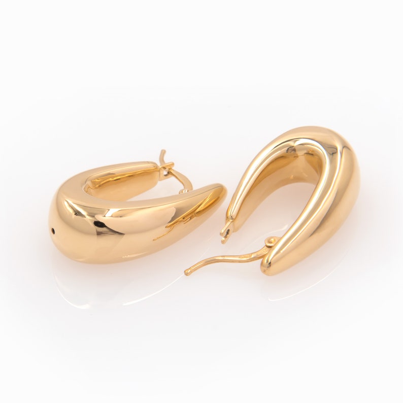 These gorgeous handmade 14k Gold Dome Hoop Chunky Earrings have a unique design  for any other special occasion.
Made of 14k solid gold, they have a chunky dome shape that exudes confidence.
They have an easy to use and secure latch back closure