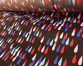 Marimekko Pisaroi poplin fabric for clothing, multi coloured on black background, sold by yard