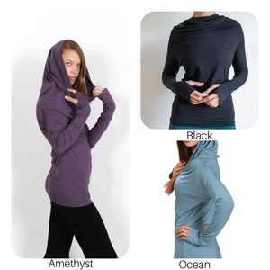 May include: Three long-sleeved shirts with a cowl neck and thumbholes. The shirts are in amethyst, black, and ocean blue.