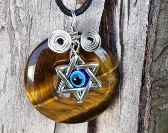 Tiger Eye A Stone For Courage And protection Pendant Size 30.mm With Evil Eye Symbol Attached On A Free Fully Adjustable Strong  Waxed Cord.