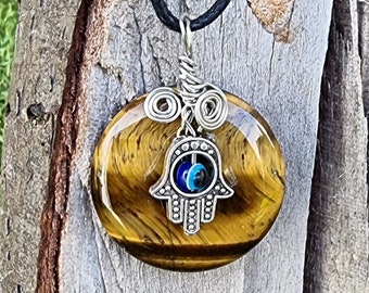 Tiger Eye A Stone For Courage And protection Pendant Size 30.mm With Evil Eye Symbol Attached On A Free Fully Adjustable Strong  Waxed Cord.