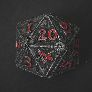 May include: A twenty-sided die with a metallic grey finish and red numbering. The die features intricate designs and symbols, with the number 20 prominently displayed. Suitable for tabletop gaming.
