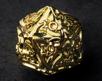 May include: A gold-colored twenty-sided die with intricate designs and numbers on each face.