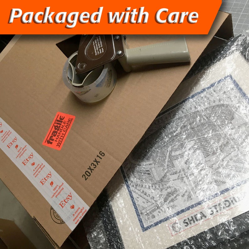 May include: A cardboard box with the text "Packaged with Care" in an orange banner. The box is sealed with tape and has a "Fragile, Handle with Care" sticker. The dimensions are 20 x 3 x 16 inches.