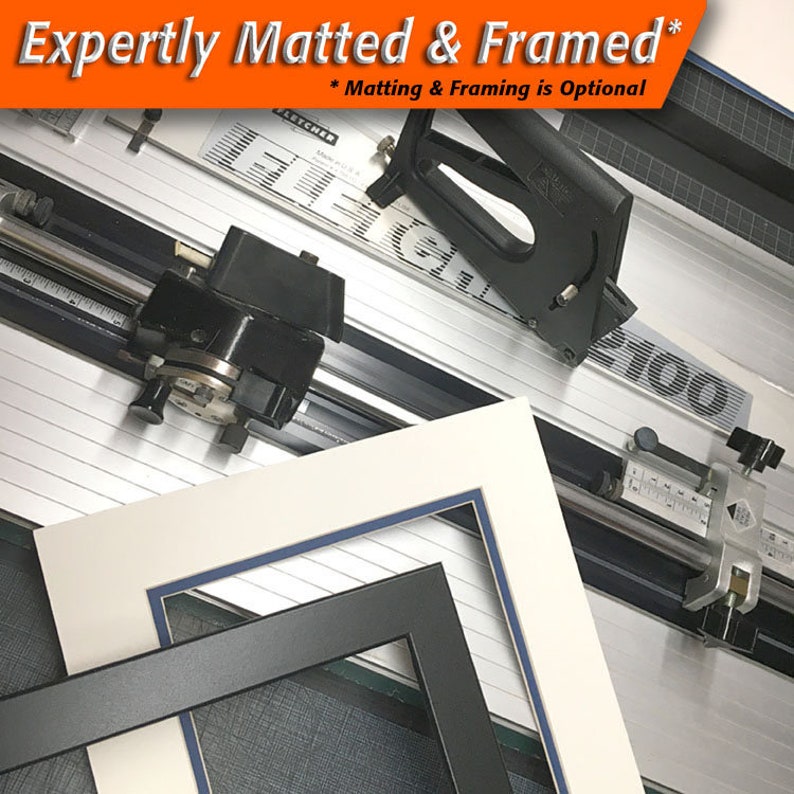 May include: A professional mat cutter with a white and blue mat and a black frame. The image also includes the text "Expertly Matted & Framed" and "* Matting & Framing is Optional".