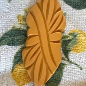 Art Deco Bakelite Brooch Deeply Carved Butterscotch