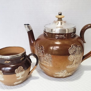 Royal Doulton Lambeth Teapot and Sugar Bowl / Sterling Band