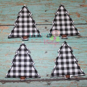 May include: Four fabric Christmas tree appliques featuring a black and white buffalo plaid pattern. Each tree has a small brown rectangular trunk at the base and is outlined with black stitching. The design is flat and triangular in shape.