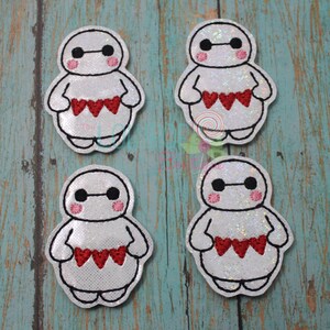 May include: Four white felt patches with an embroidered image of Baymax from the movie Big Hero 6. Each patch has a red heart design on the front.