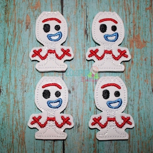 May include: Four white felt appliques of the character 'Forky' from the movie Toy Story 4. Each applique has a red, blue, and black embroidered face with a red and white embroidered body.