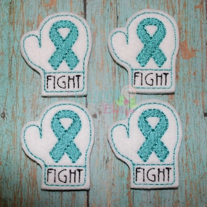 May include: Four white felt patches shaped like boxing gloves, each featuring an embroidered teal awareness ribbon and the word FIGHT stitched in black thread. The edges of the patches are finished with teal decorative stitching.