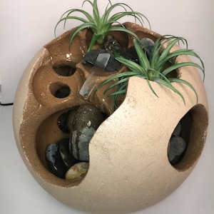 Unique Spherical Waterfall with adjustable sound. The perfect fountain for the home or office.  The fountain has an amazing peaceful sound.