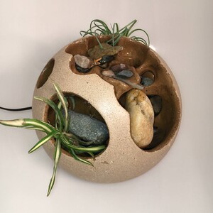 Artistic Handmade spherical tabletop fountain with incredibly peaceful sound. Perfect for the home or office. stones are adjustable.