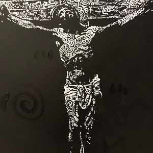 May include: A black and white painting of a person on a cross. The person is depicted with intricate details and patterns throughout the body and cross.
