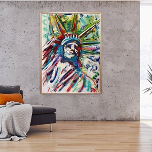 Puede incluir: Pintura abstracta de la Estatua de la Libertad en un estilo moderno con colores brillantes, incluyendo azul, verde, rojo y amarillo. La pintura est&aacute; enmarcada en un marco dorado.