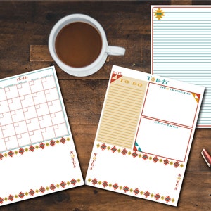 May include: A set of printable planner pages with a Southwestern design. The pages include a monthly calendar, a to-do list, and a notes section. The pages are decorated with a geometric pattern in red, yellow, and blue.