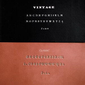 May include: Two leather samples with different font styles. The top sample is black with white text that reads "VINTAGE" and includes the alphabet and the word "JOHN". The bottom sample is brown with gold text that reads "CLASSIC" and includes the alphabet and the word "John".
