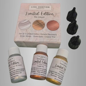 May include: A set of three limited edition metallic re-inkers in silver, gold, and copper, with three black bottle caps. The packaging reads "Limited Edition" and "Lisa Horton Crafts."