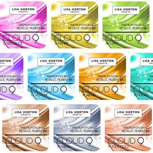 May include: A collection of Lisa Horton Crafts Cloud 9 premium dye-based metallic pigment inks. The inks come in various colors, including Lovestruck, Sunshine, Mojito, Ultraviolet, Coastline, Pumpkin, Verdigris, Bronze, Titanium, and Fools Gold.