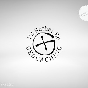 May include: Black and white decal with the text "I'd Rather Be Geocaching" in a circle around a compass symbol.