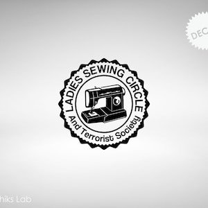 May include: Black and white decal of a sewing machine with the text "Ladies Sewing Circle and Terrorist Society" around it.