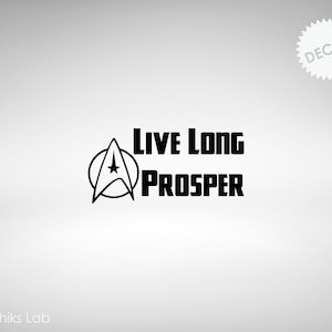 May include: Black decal featuring the Star Trek emblem and the words "Live Long and Prosper" in a bold, sans-serif font. The word "Decal" is in a starburst shape in the upper right corner. The brand name "Graphiks Lab" is at the bottom.