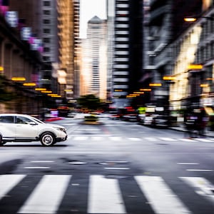 Downtown Chicago Board of Trade.  Urban photography panning of traffic on La Salle Street in front of the Art Deco CBOT building