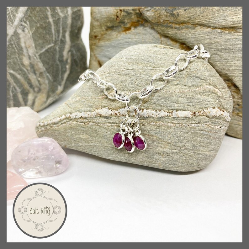 Sterling Silver bracelet with Ruby charms