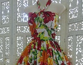 Summery 50s style halter neck full skirt sundress in cotton voile in a red, green orange floral print is newly made by Red Ruby Originals