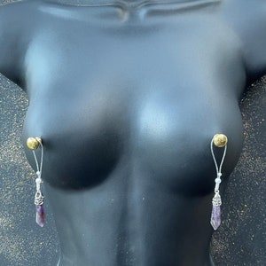 Fake nipple rings. Nipple jewellery attracts attention to the most beautiful part of woman&#39;s body. Mature.