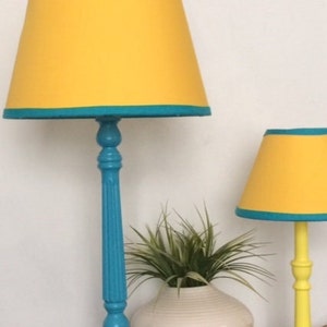 yellow lampshade with turquoise blue lamp stand