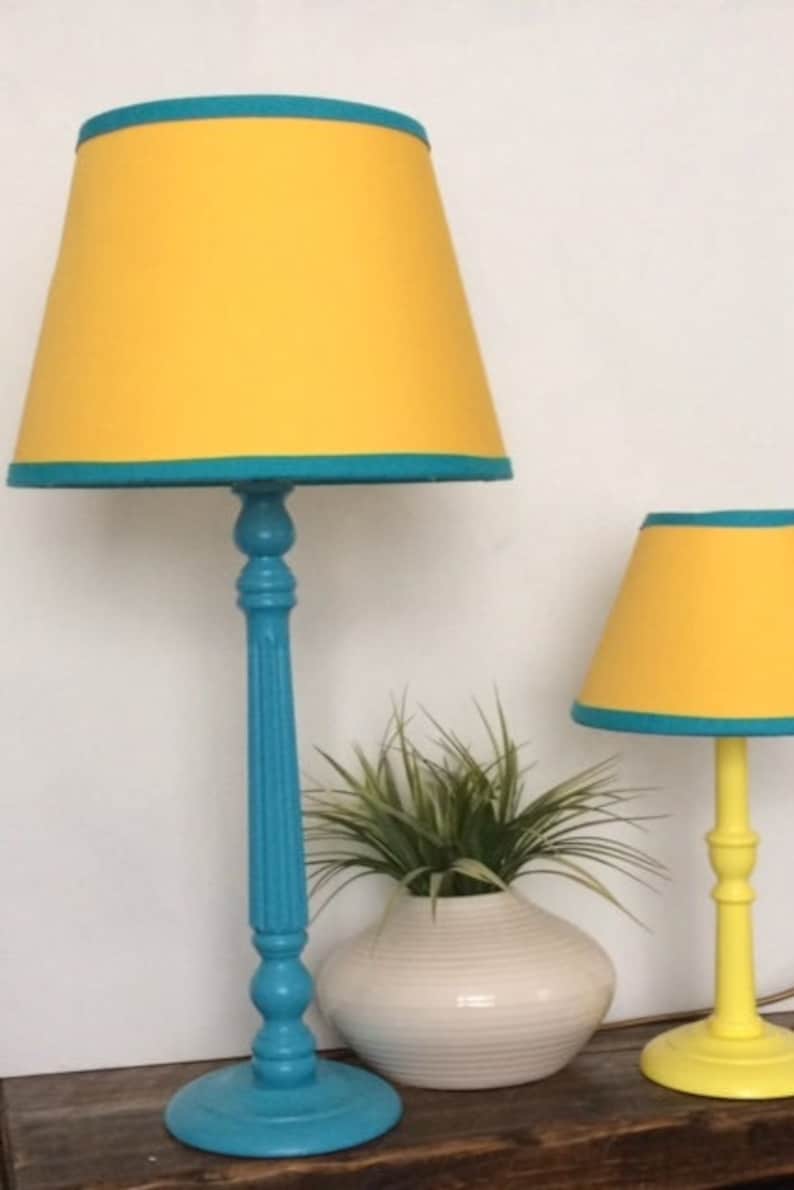 yellow lampshade with turquoise blue lamp stand