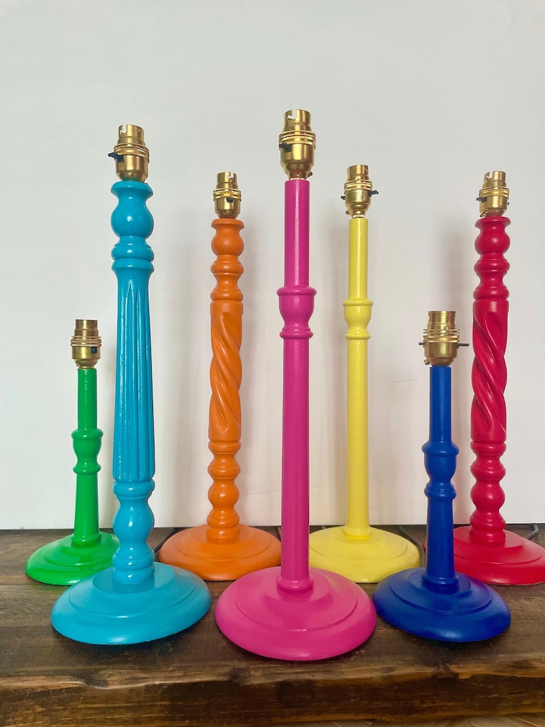 group of colourful painted table lamp stands