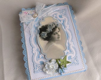 Scrapbooking box, easel with vintage portrait, ribbon flowers, blue and lavender, handmade crafts