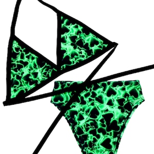 May include: A black and green bikini with a heart print. The top is a triangle style and the bottom is a high-waisted style.